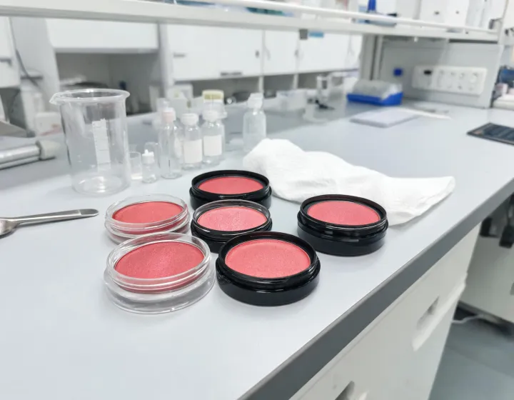 red blush on a cosmetics bench, illustration only